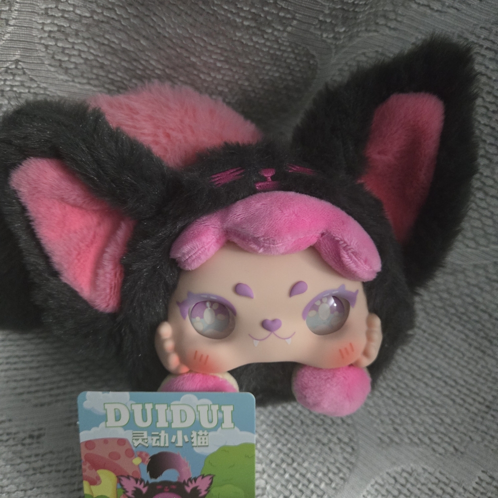 DUIDUI Plush Toy with Black and Pink Accents